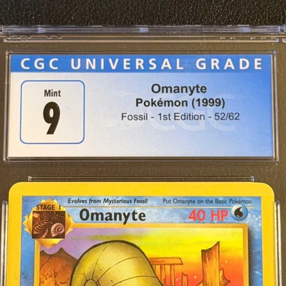 Pokemon Omanyte 1st Edition Fossil 52/62 CGC 9 Mint Blue Label TCG 1999 WotC Vtg